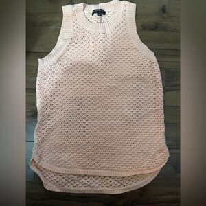 This is a Banana Republic peach sleeveless open-knit sweater vest.